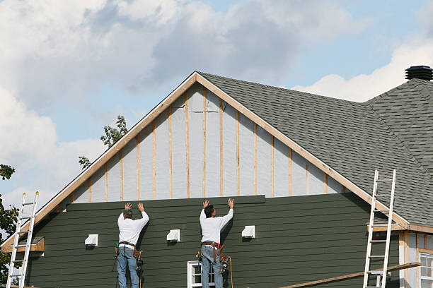 Professional Siding technician working in Oakville, CT